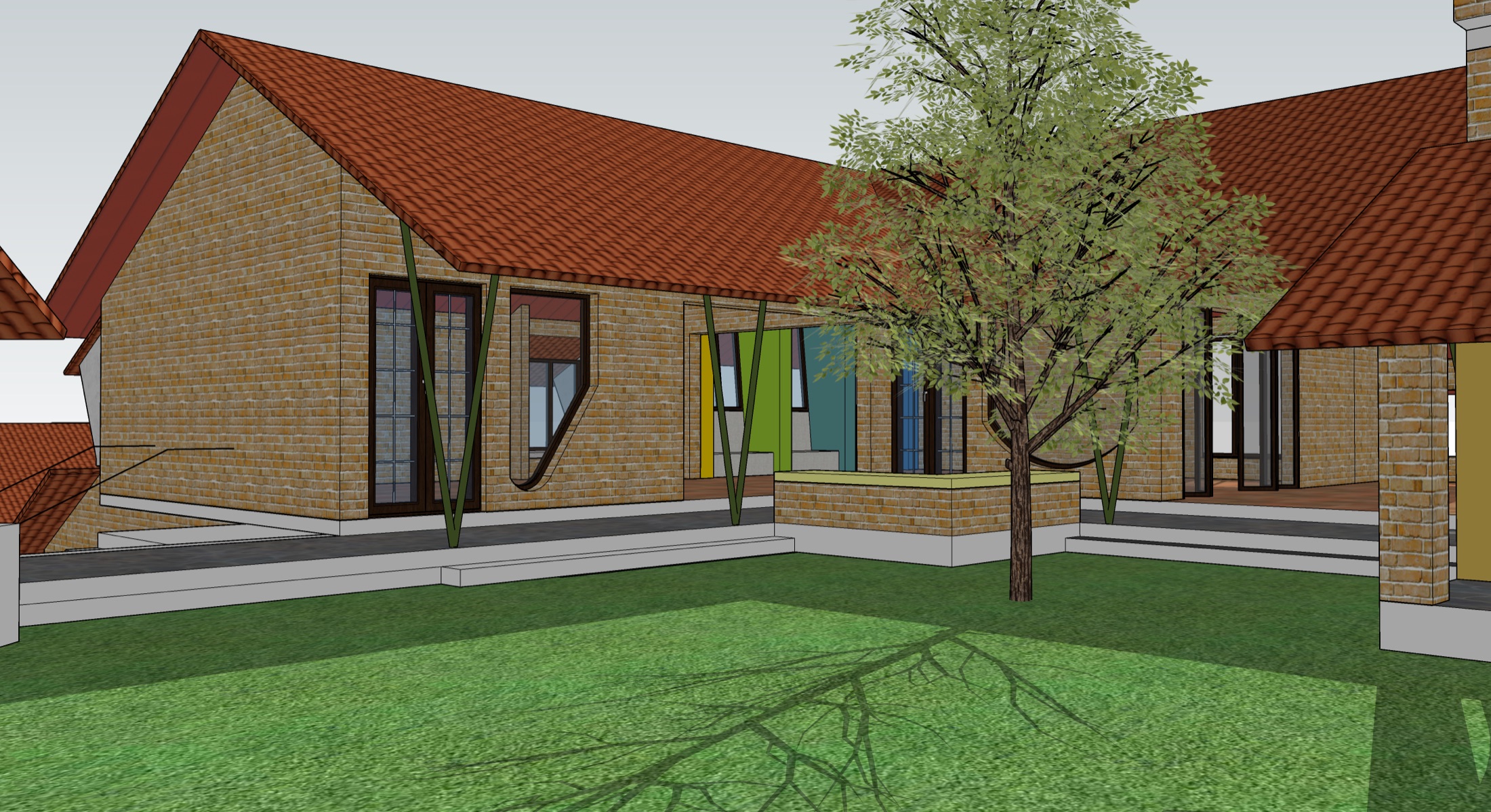 A view of the new Vidyodaya campus design, low buildings among lawns and trees